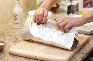 salmon in foil- rolling up foil
